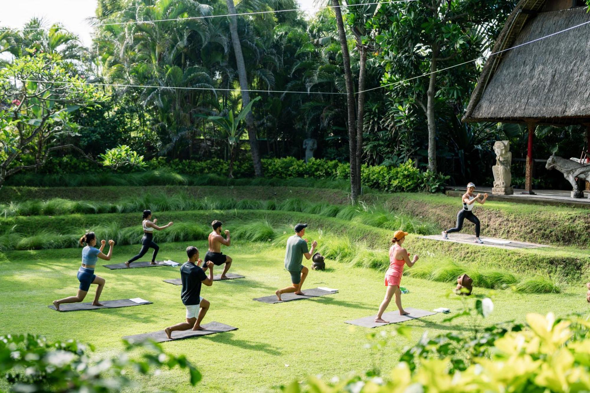 Bali Mandira Beach Resort & Spa Legian Exterior foto A yoga class at the farm
